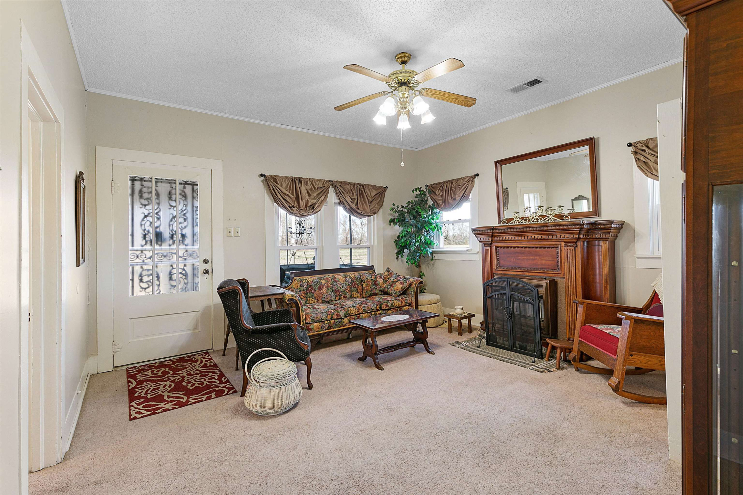 5118 Old Jackson Road Bells, TN 38006 - Photo 5 of 21 a bedroom with furniture and a fireplace