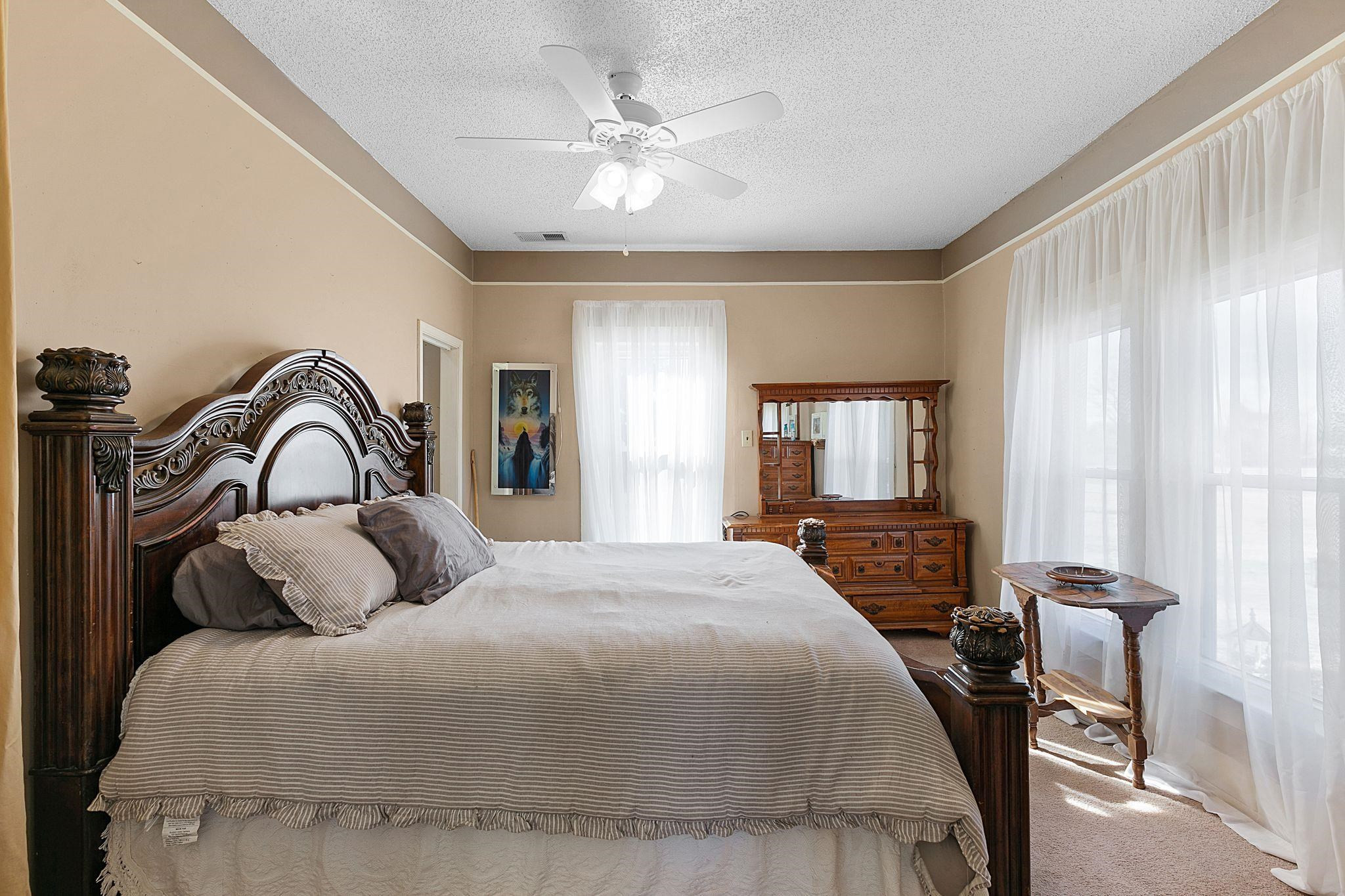 5118 Old Jackson Road Bells, TN 38006 - Photo 8 of 21 a bedroom with a bed and a window