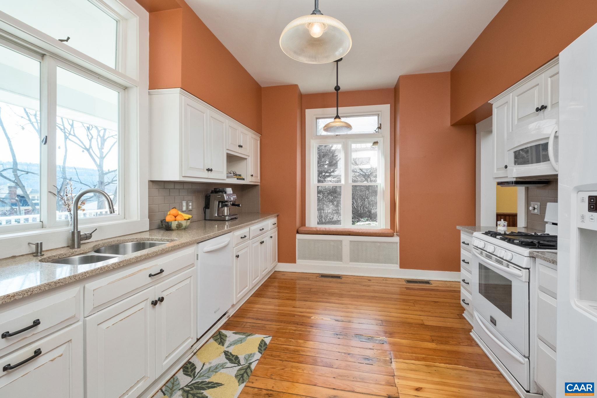 428 Maple Avenue Waynesboro, VA 22980 - Photo 11 of 69 a large kitchen with stainless steel appliances granite countertop a stove a sink dishwasher and white cabinets with wooden floor