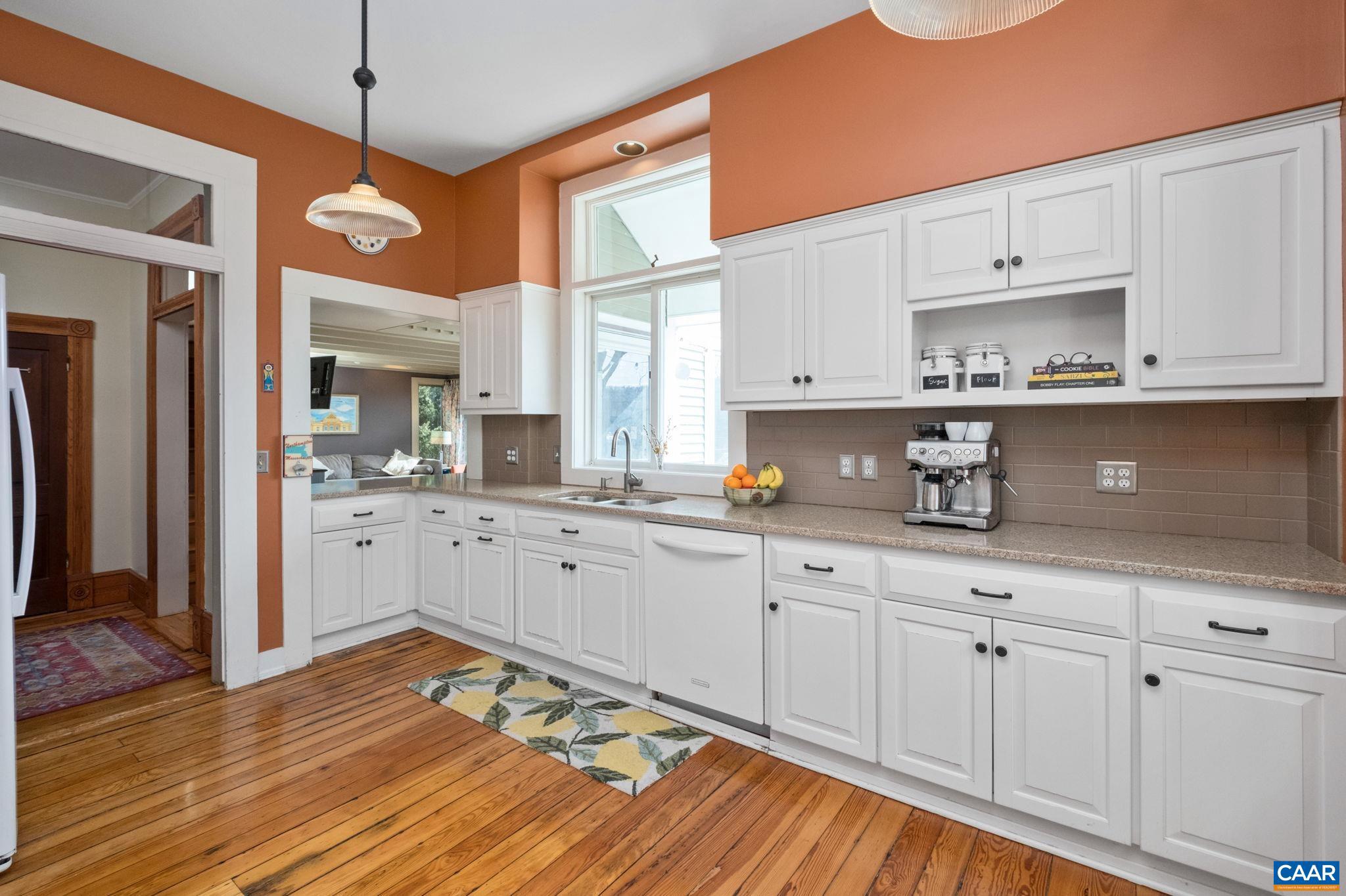 428 Maple Avenue Waynesboro, VA 22980 - Photo 13 of 69 a kitchen with granite countertop white cabinets and white appliances