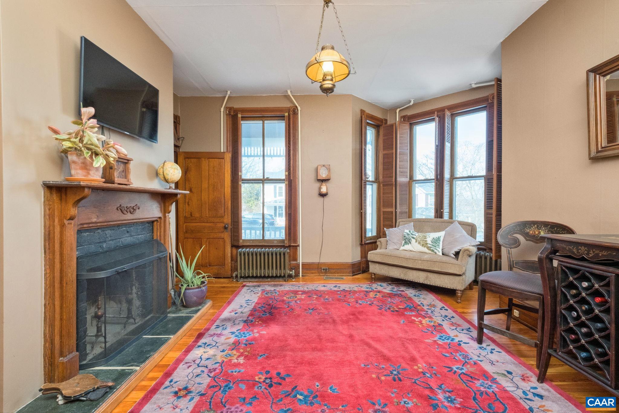 428 Maple Avenue Waynesboro, VA 22980 - Photo 28 of 69 a living room with furniture fireplace and flat screen tv