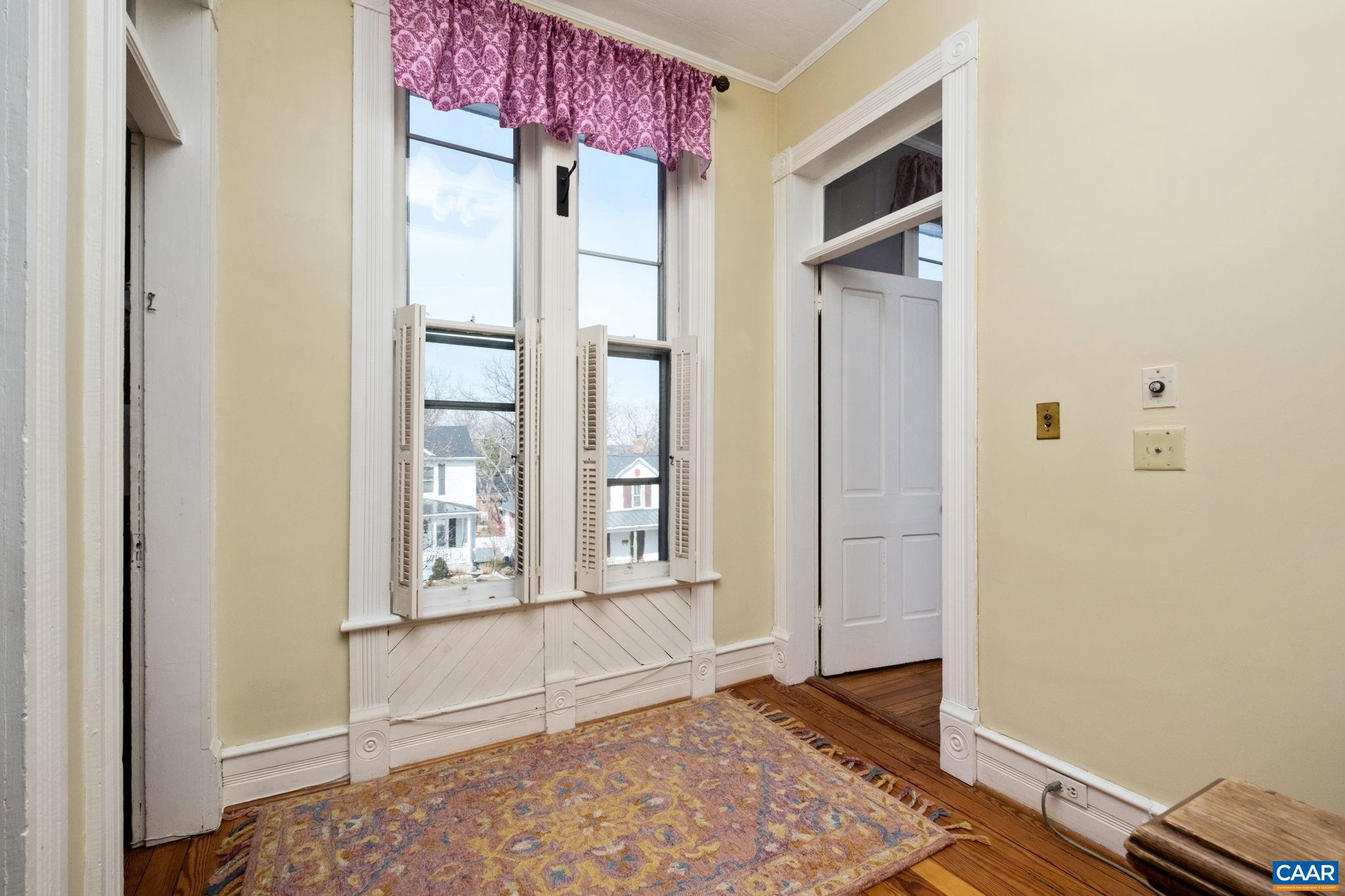 428 Maple Avenue Waynesboro, VA 22980 - Photo 32 of 69 a view of an empty room with a window and wooden floor