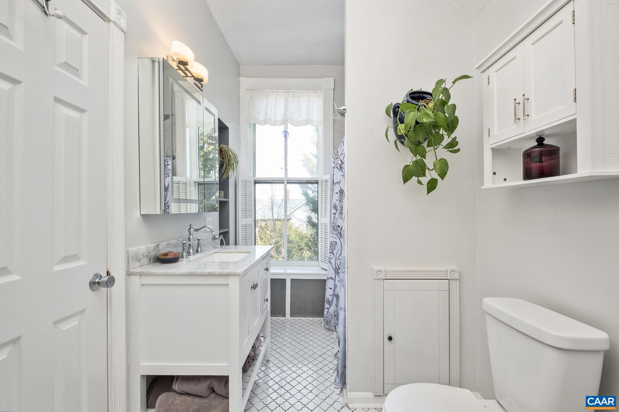 428 Maple Avenue Waynesboro, VA 22980 - Photo 35 of 69 a bathroom with a toilet sink and mirror