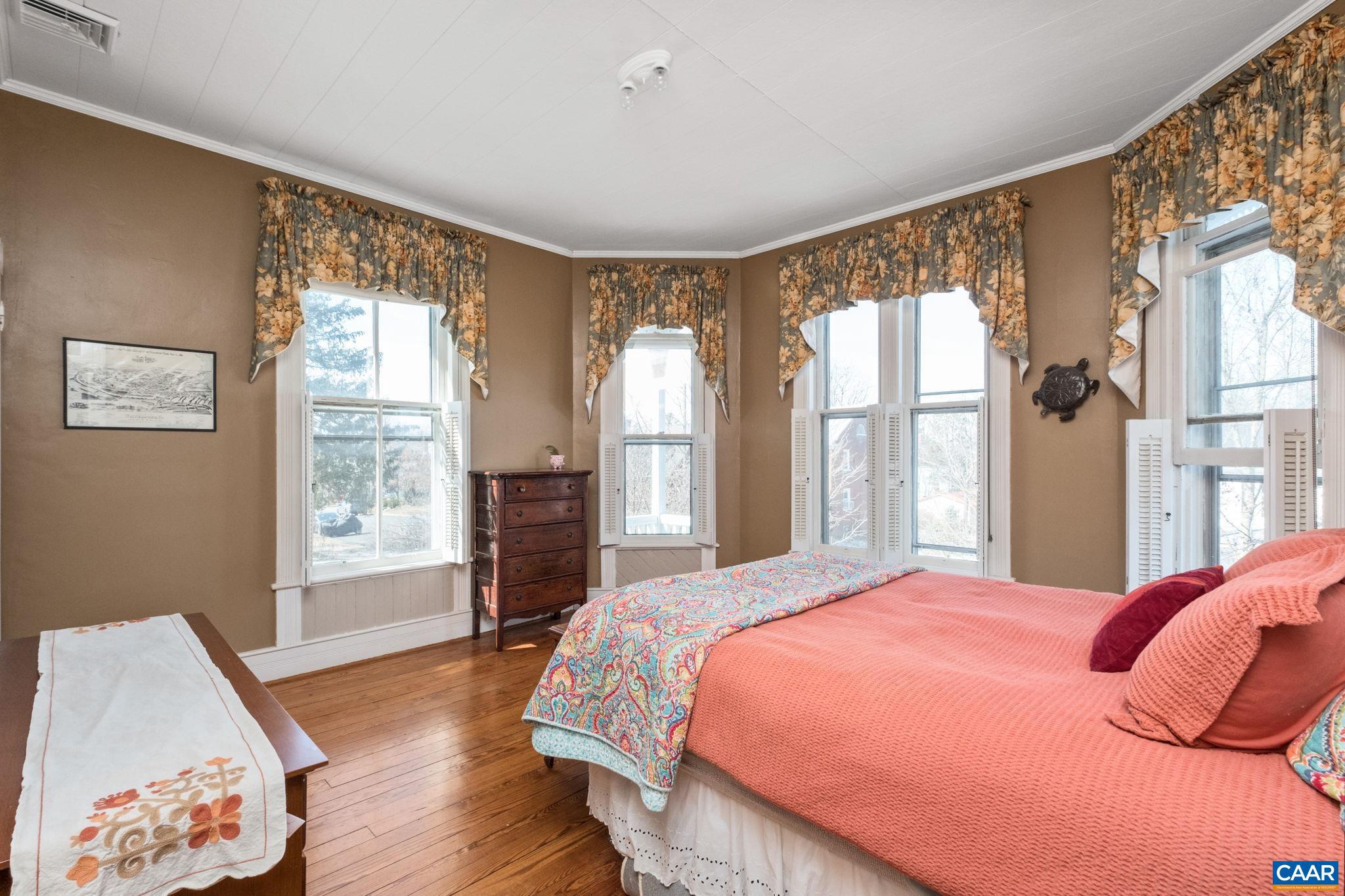 428 Maple Avenue Waynesboro, VA 22980 - Photo 37 of 69 a bedroom with a large bed and wooden floor