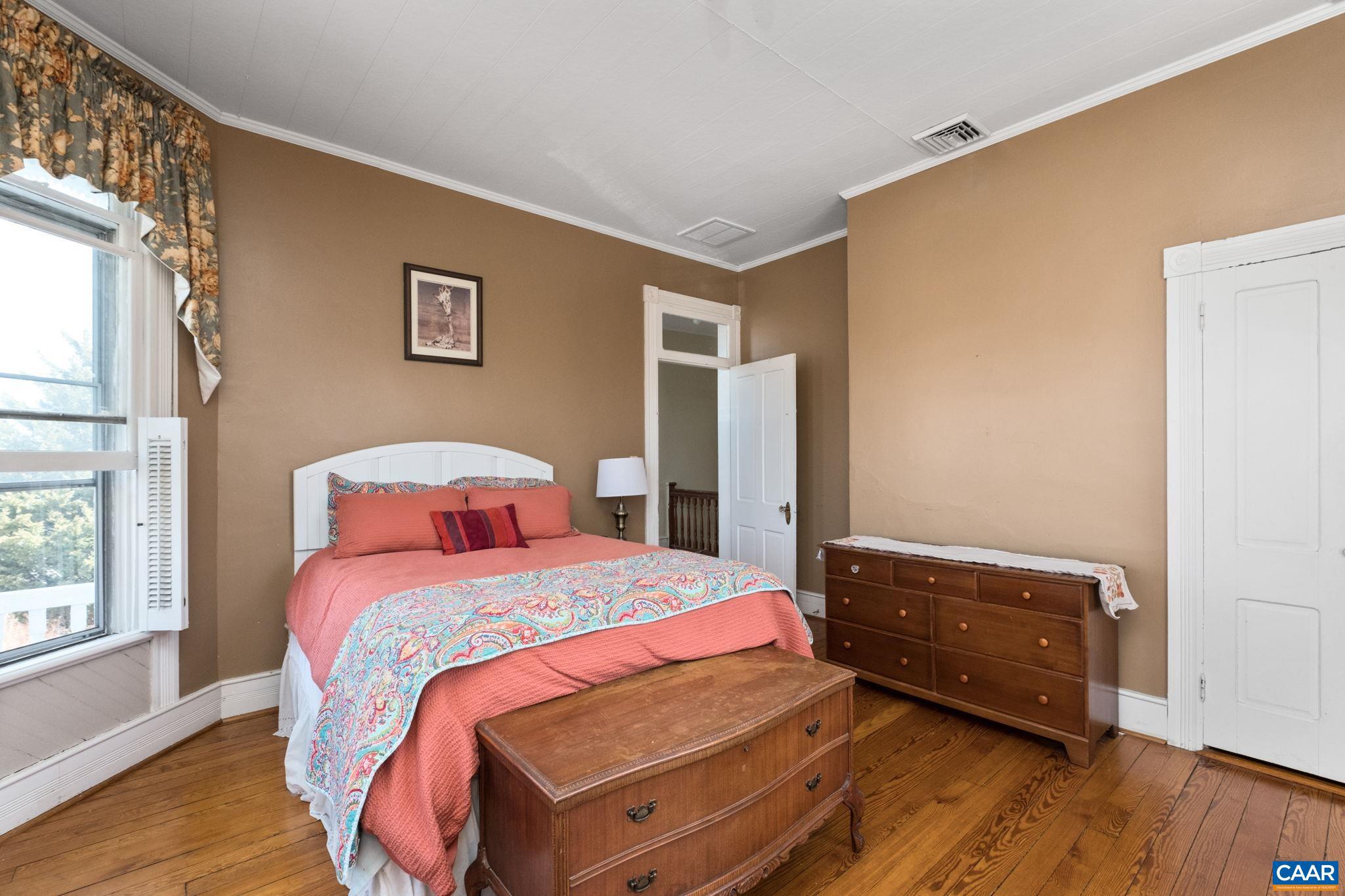 428 Maple Avenue Waynesboro, VA 22980 - Photo 38 of 69 a bedroom with a bed and wooden floor