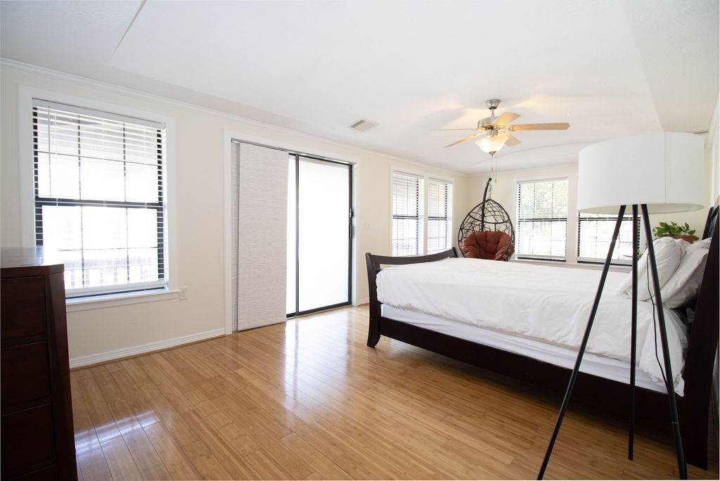5201 Chapman Street Houston, TX 77009 - Photo 13 of 30 a bedroom with a bed and a window