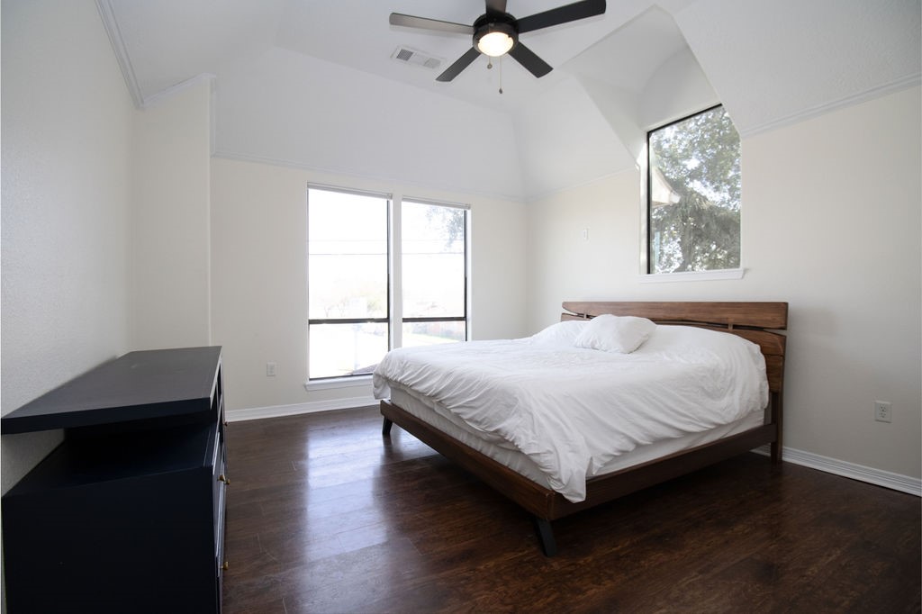5201 Chapman Street Houston, TX 77009 - Photo 25 of 30 a bedroom with a bed and a window