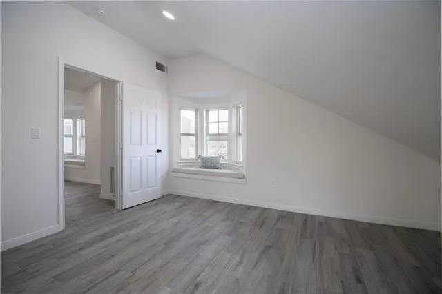 a kitchen with a sink and a fireplace
