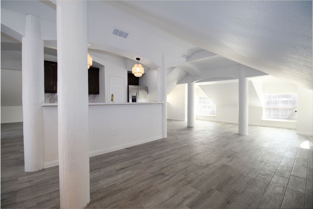 5201 Chapman Street Houston, TX 77009 - Photo 30 of 30 a view of a room with wooden floor and stairs