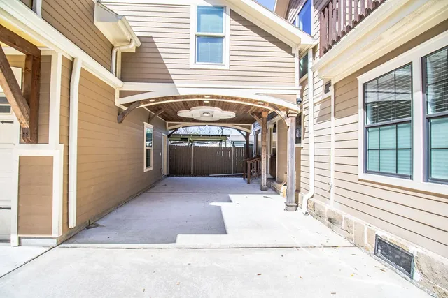 a view of staircase with railing and a rug