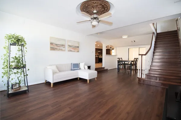 a view of a livingroom with furniture and a flat screen tv