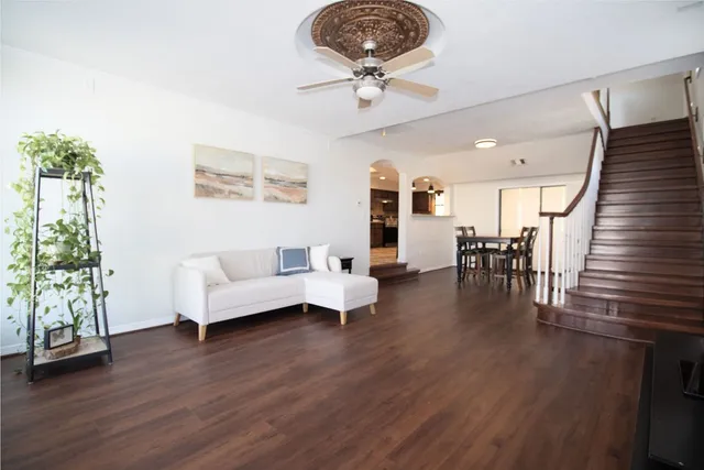 a view of a livingroom with furniture and a flat screen tv