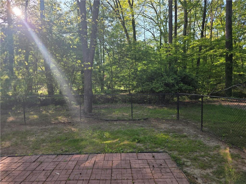 4055 Kelden Court Southwest Atlanta, GA 30349 - Photo 4 of 10 a backyard of a house with lots of green space