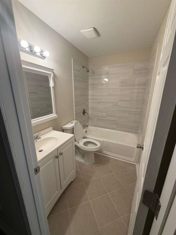 4055 Kelden Court Southwest Atlanta, GA 30349 - Photo 8 of 10 a bathroom with a granite countertop sink toilet and shower