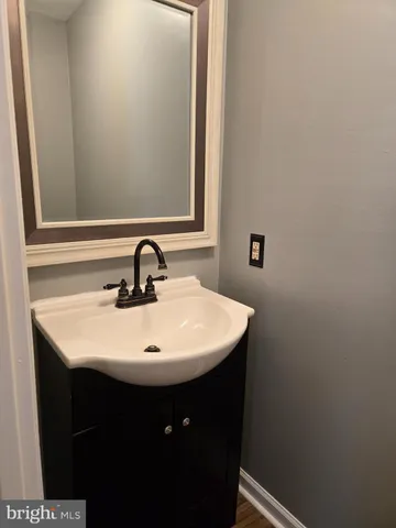 a close up of a sink and a mirror