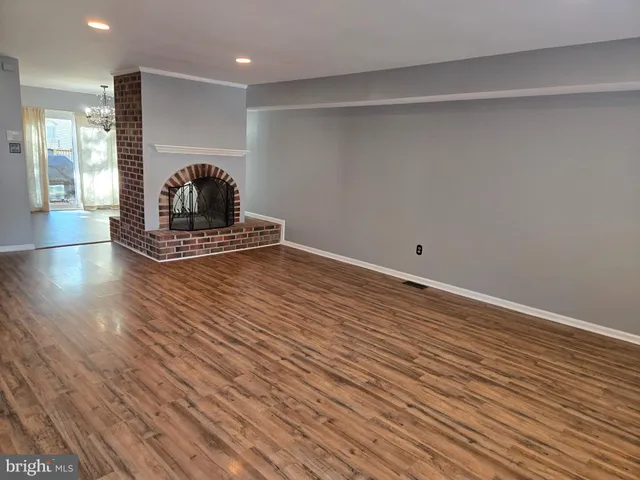 a view of a livingroom with wooden floor