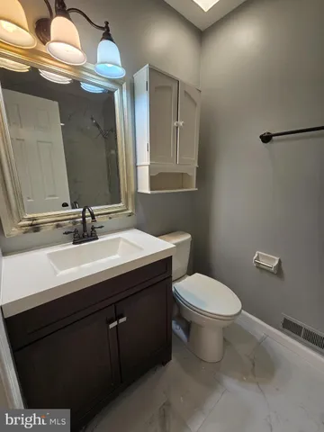 a bathroom with a sink and a toilet