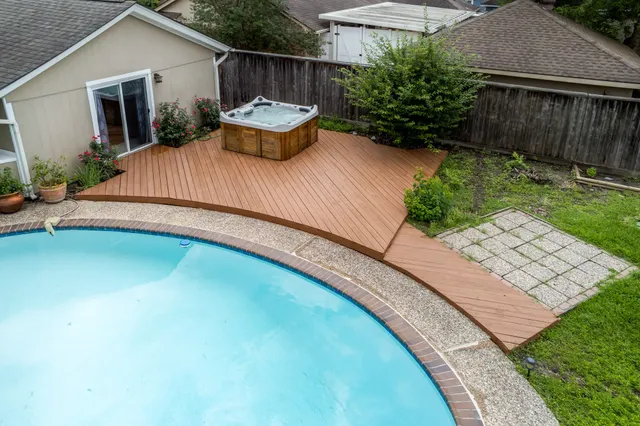 a view of a backyard with sitting area