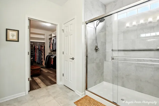 a bathroom with a shower and a bath tub