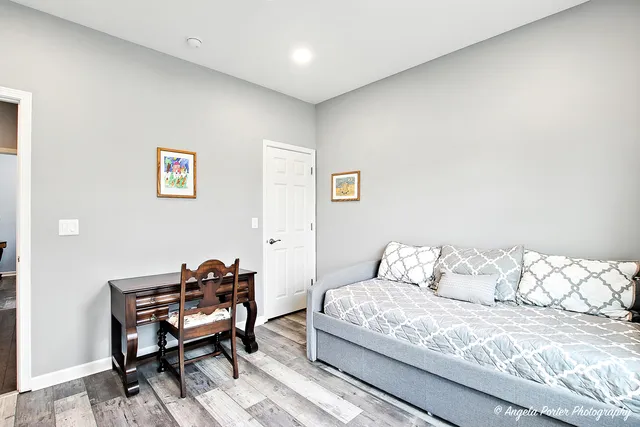 a bedroom with a bed and a couch