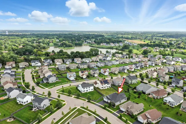 an aerial view of residential houses with outdoor space