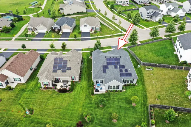 an aerial view of multiple houses with outdoor space