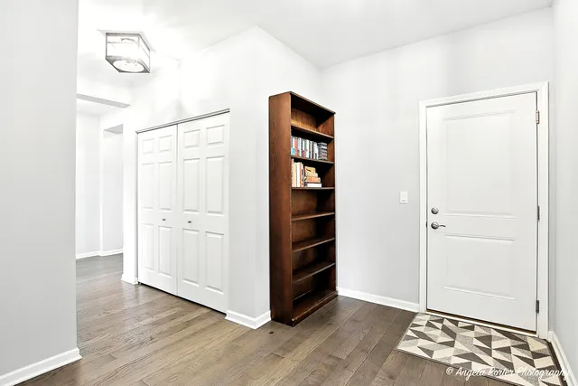 a view of room with wooden floor