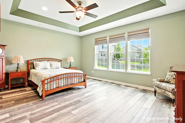 a spacious bedroom with a bed and a window