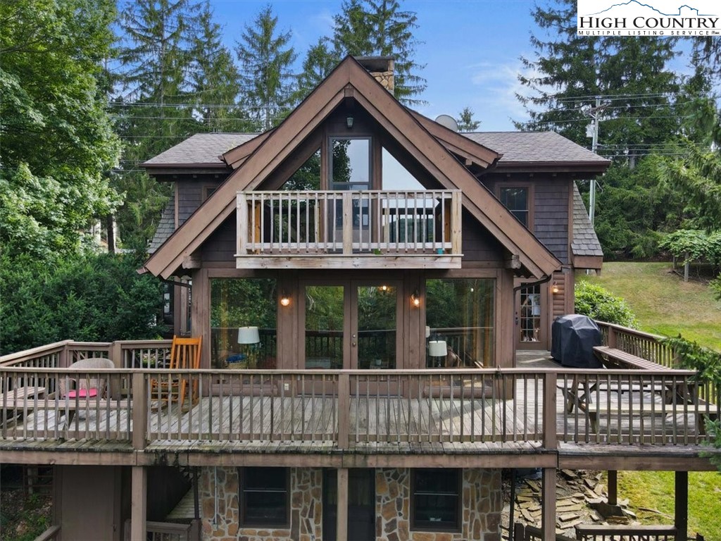117 Chinkapin Ridge Road Seven Devils, NC 28604 - Photo 1 of 43 a front view of a house with balcony