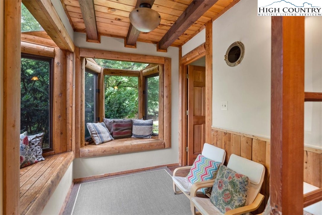 117 Chinkapin Ridge Road Seven Devils, NC 28604 - Photo 13 of 43 a living room with furniture and a window