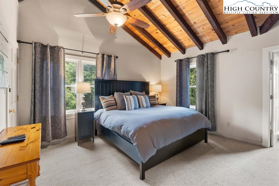 117 Chinkapin Ridge Road Seven Devils, NC 28604 - Photo 20 of 43 a bedroom with a bed and a window