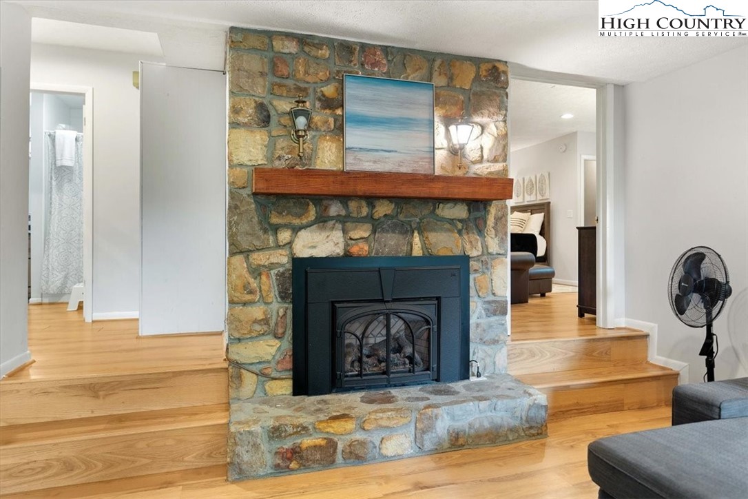 117 Chinkapin Ridge Road Seven Devils, NC 28604 - Photo 27 of 43 a living room with furniture and a fireplace