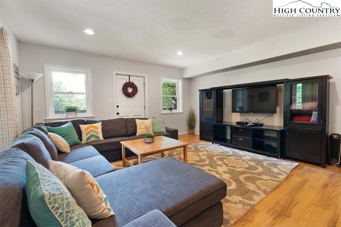 117 Chinkapin Ridge Road Seven Devils, NC 28604 - Photo 28 of 43 a living room with furniture and a flat screen tv