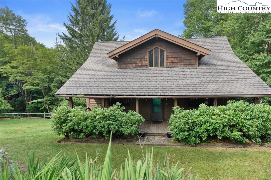 117 Chinkapin Ridge Road Seven Devils, NC 28604 - Photo 33 of 43 a front view of a house with a garden