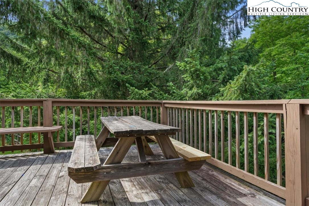 117 Chinkapin Ridge Road Seven Devils, NC 28604 - Photo 34 of 43 a view of balcony with wooden floor and outdoor seating