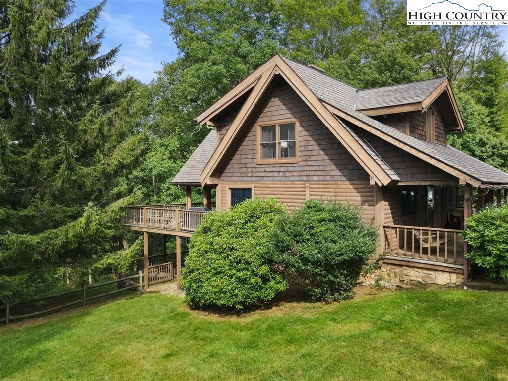 117 Chinkapin Ridge Road Seven Devils, NC 28604 - Photo 36 of 43 a front view of a house with a yard