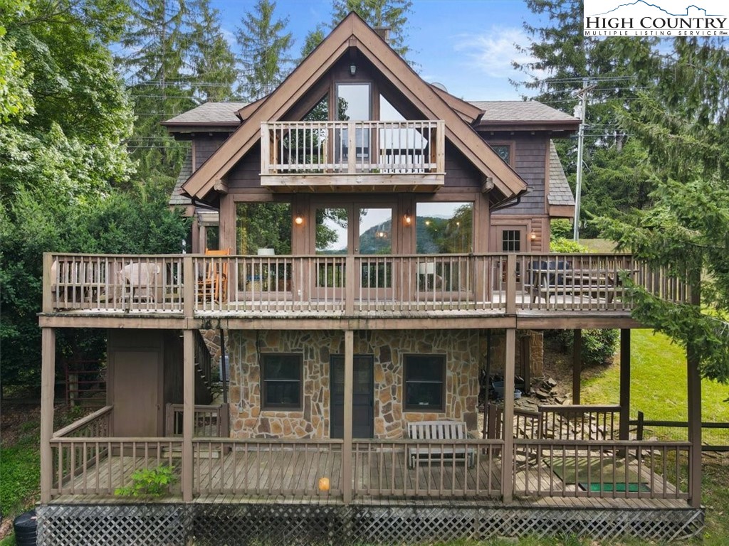 117 Chinkapin Ridge Road Seven Devils, NC 28604 - Photo 39 of 43 a front view of a house with balcony