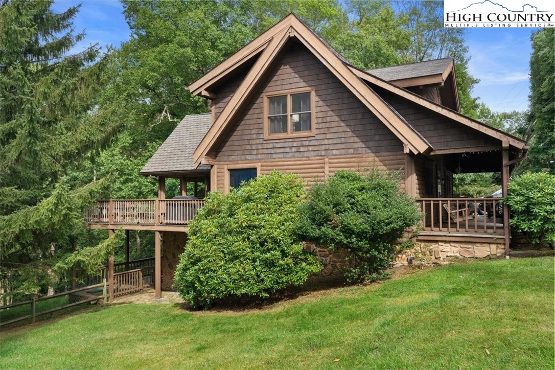 117 Chinkapin Ridge Road Seven Devils, NC 28604 - Photo 4 of 43 a front view of house with a garden