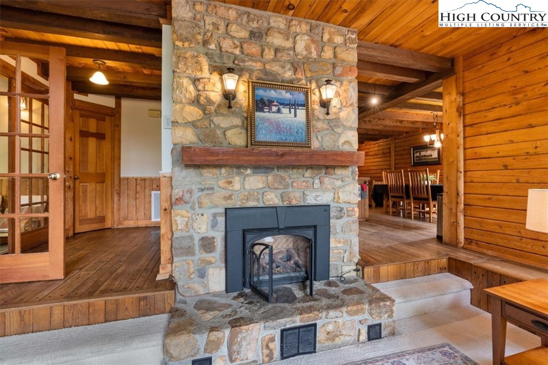 117 Chinkapin Ridge Road Seven Devils, NC 28604 - Photo 7 of 43 a living room with furniture and a fireplace