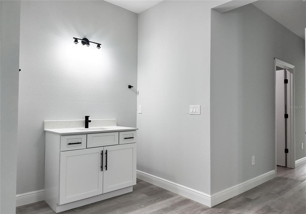7 Spring Pass Ocala, FL 34472 - Photo 13 of 35 a view of cabinets with wooden floor