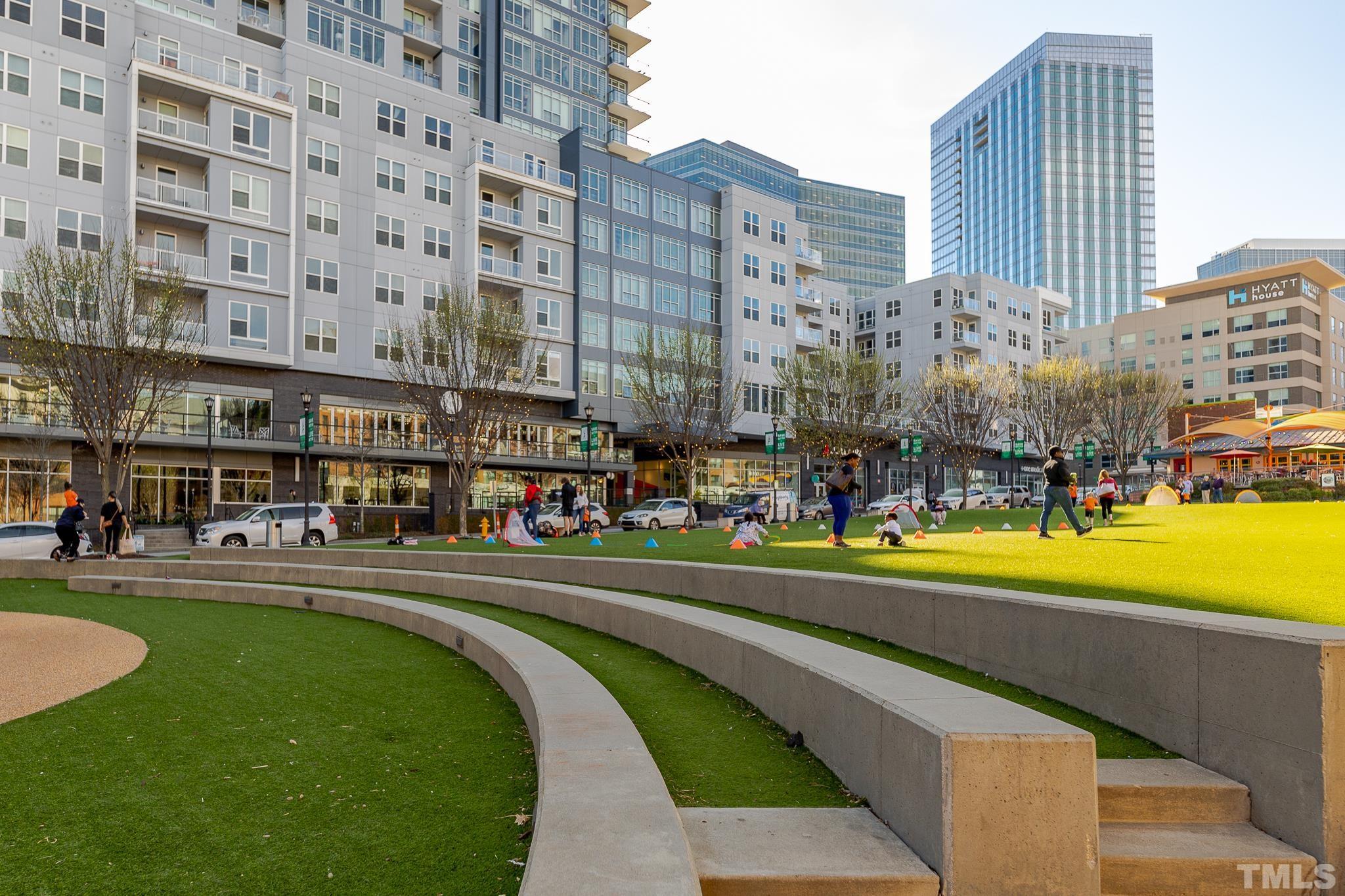 5705 Tall Pines Court Raleigh, NC 27609 - Photo 28 of 36 a front view of a building with a swimming pool