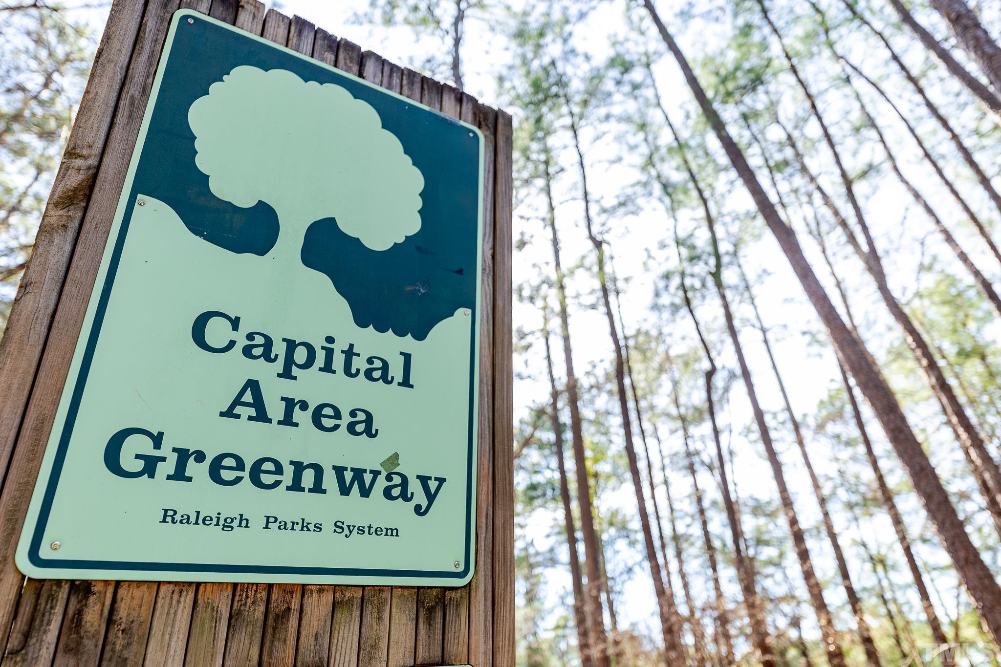 5705 Tall Pines Court Raleigh, NC 27609 - Photo 33 of 36 a sign that is on the side of a building