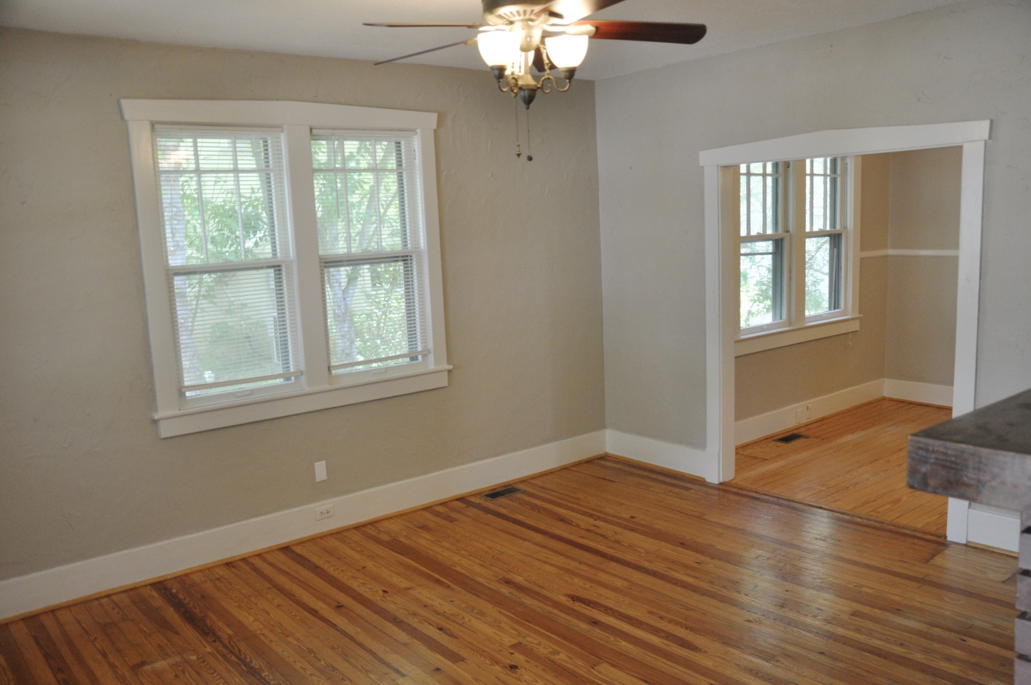 602 3rd Avenue West Springfield, TN 37172 - Photo 3 of 37 a view of an empty room with wooden floor and a window