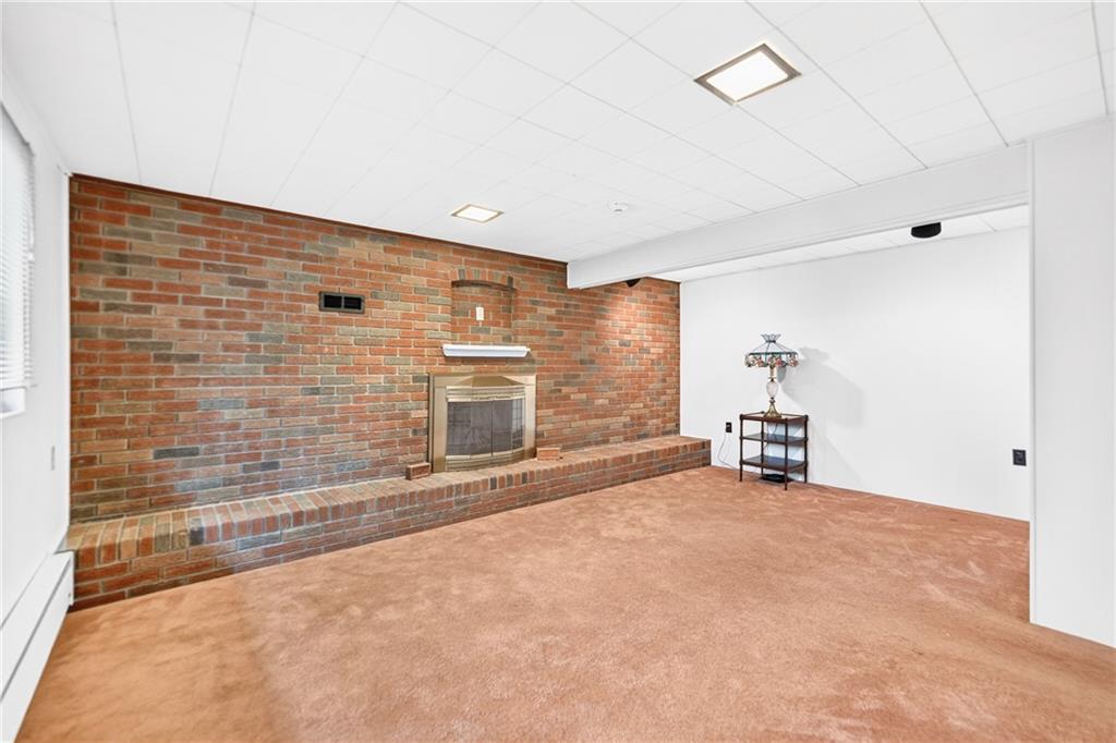 224 Bowman Road Bridgeville, PA 15017 - Photo 29 of 50 Plan those game nights! The fireplace is the centerpiece of this lower level game room. Just have it checked and spruced up before use. The sellers haven't used it in years. This room also gets gorgeous sunlight! It's the perfect cozy retreat!