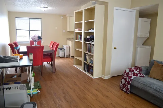 a livingroom with furniture and wooden floor