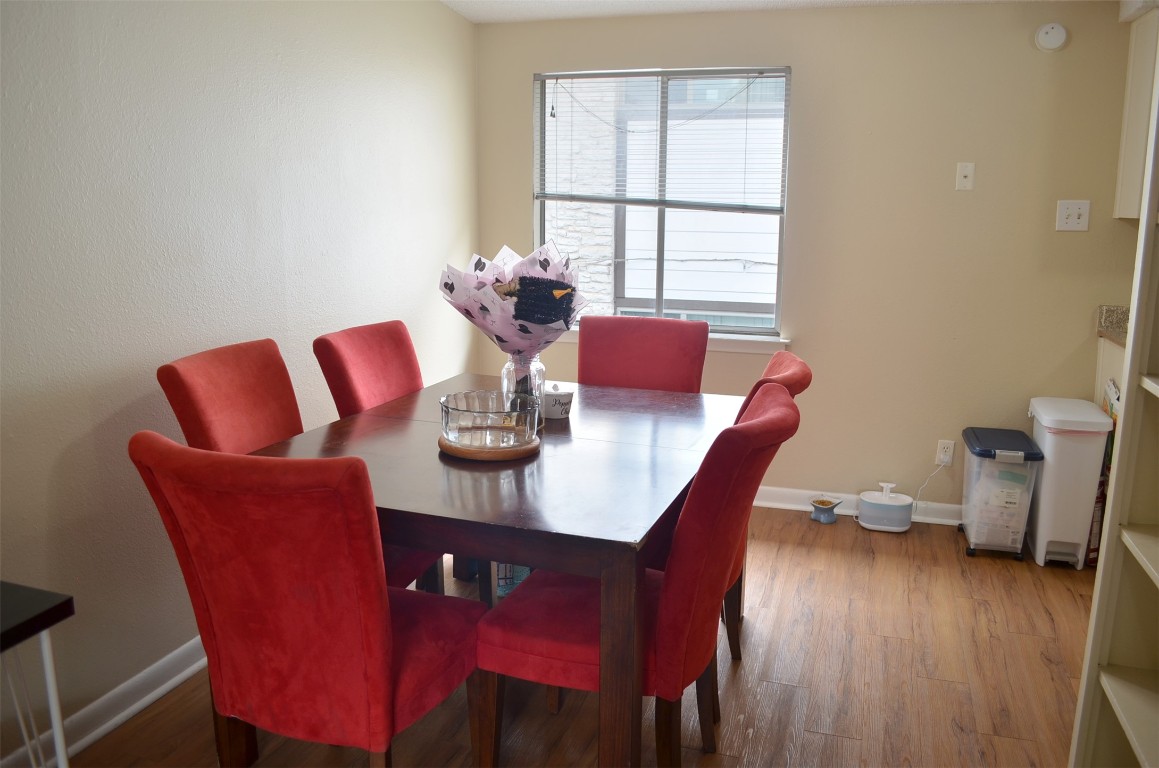 2408 Longview Street, Unit 211 Austin, TX 78705 - Photo 4 of 10 a dining room with furniture and wooden floor