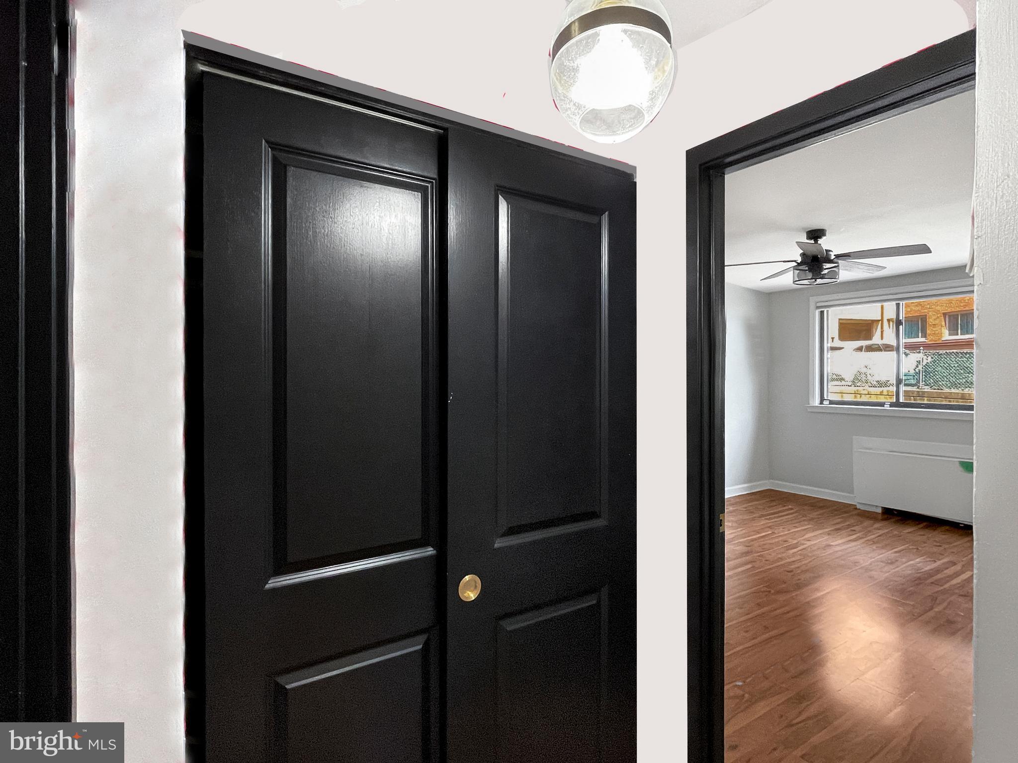 2725 39th Street Northwest, Unit 2O9 Washington, DC 20007 - Photo 13 of 35 a view of an empty room with wooden floor and a window