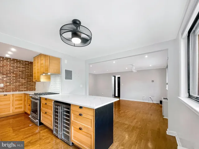 a kitchen with stainless steel appliances granite countertop a stove and a sink