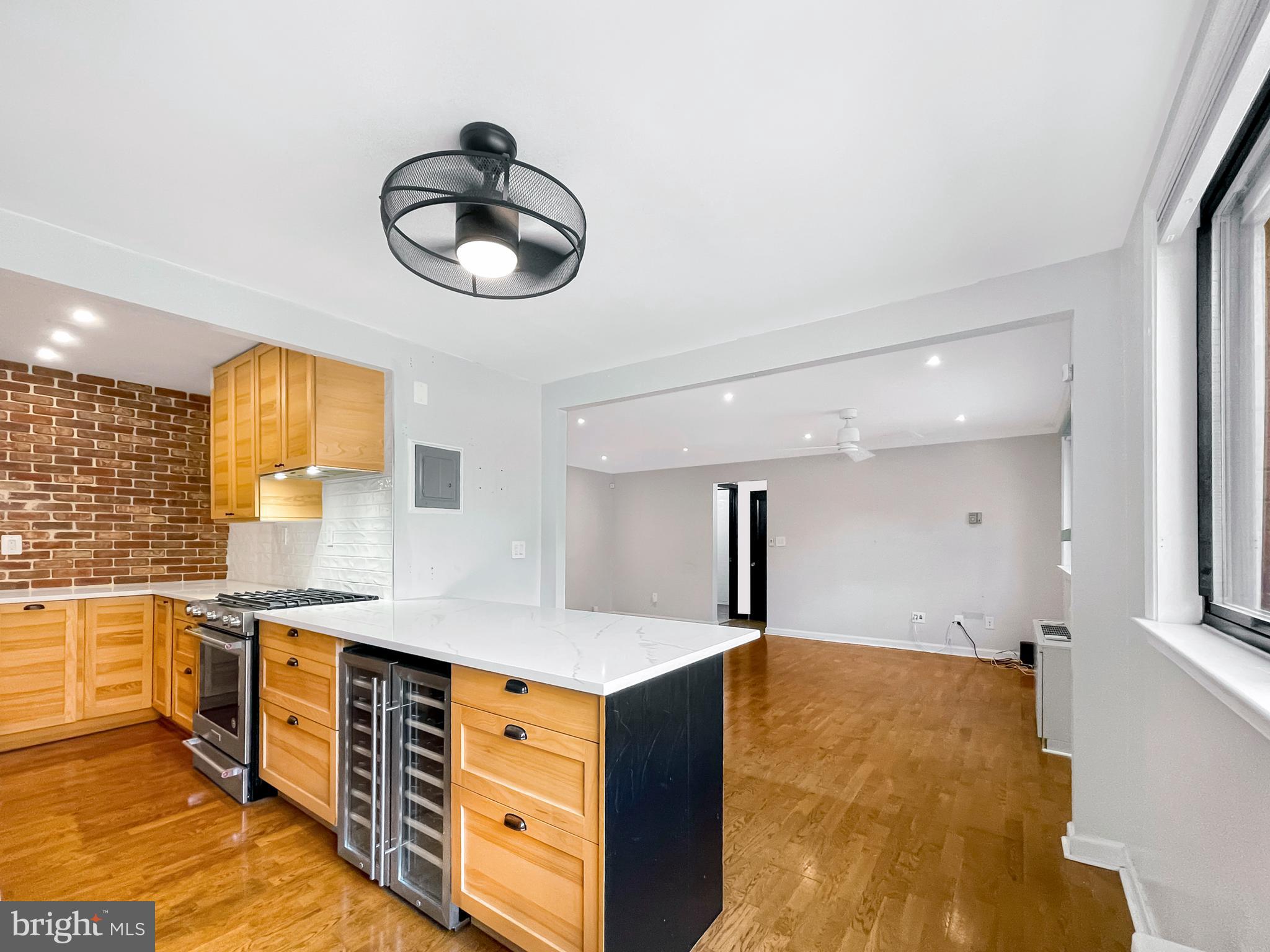 2725 39th Street Northwest, Unit 2O9 Washington, DC 20007 - Photo 3 of 35 a kitchen with stainless steel appliances granite countertop a stove and a sink