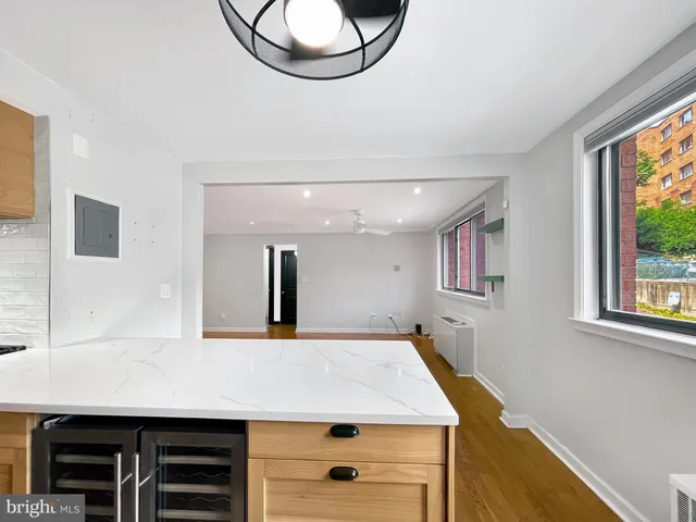 a view of a room with furniture and a window